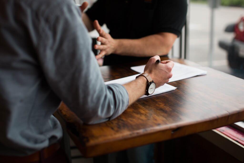 Traders Talking at a table